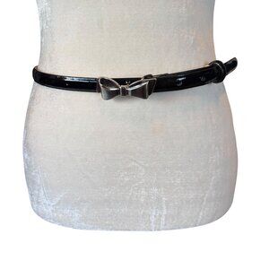 women's unbranded black leather adjustable belt with silver bow buckle M
